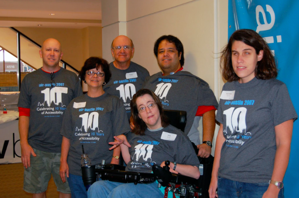 A group of six individuals wearing matching 'AIR Austin 2007' t-shirts, gathered together and posing for the camera. Each person is sporting a smile, reflecting their camaraderie and enthusiasm.