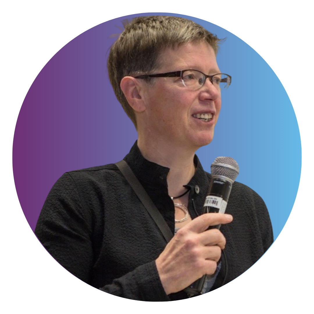 Jutta Treviranus is a woman with short hair cut above her ears. She wears a long dark shirt and black rimmed glasses.